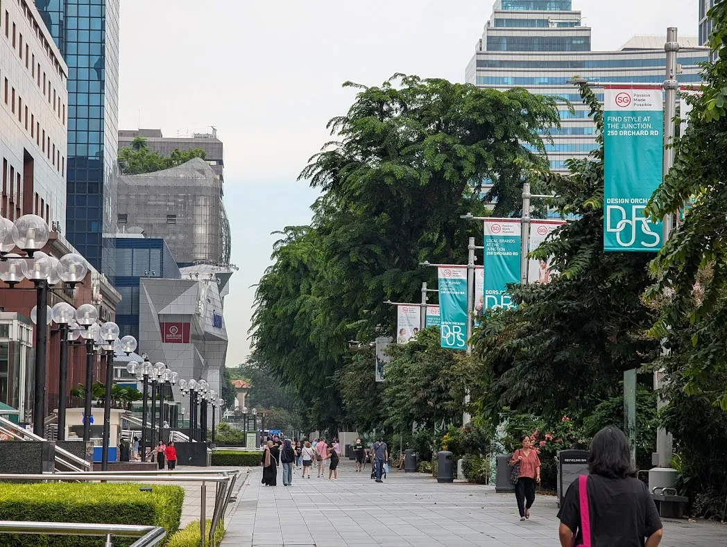 A photo looking down Orchard Road in Singapore. There’s a Kinokuniya Bookstore in the building to the left; we’re on our way to visit it and just spend some time in the aircon.