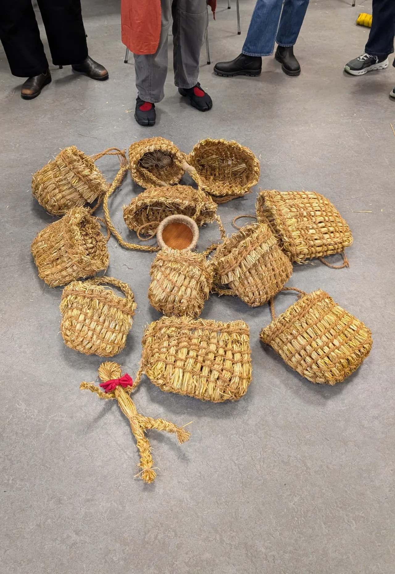 Success! Eleven Kishies and one coiled basket (Eve has kits that teach basket making in a style that mirrors how you put backs onto the chairs, one of our group was sick on the first day so she made a coil basket instead). Also a little straw person Chrissy made with some French tourists that came into the room in the museum we were using as we made baskets, the kid wanted to make something so Catherine taught us all how to make straw people.