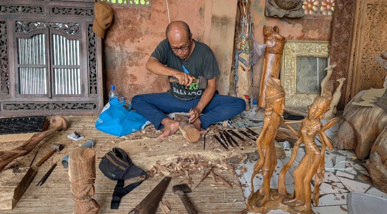 A different woodcarver plying his trade.